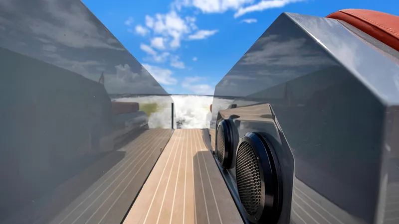 Slide: The Image of 2017 Vanquish Yachts VQ 54 deck with sleek design and blue sky background. - 19