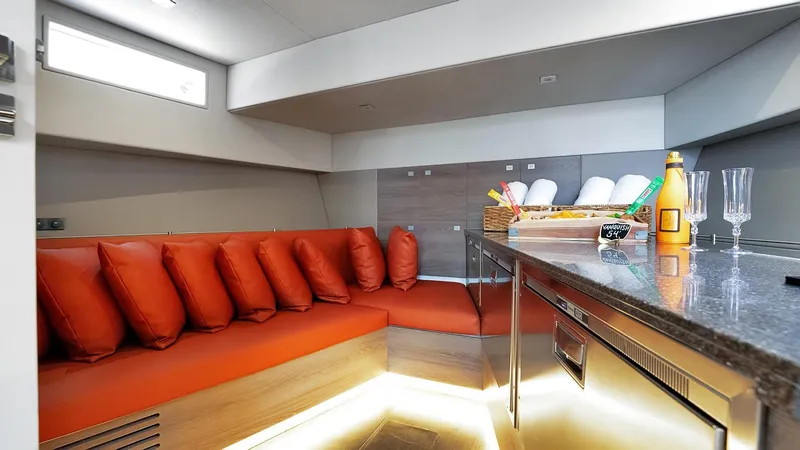 Slide: The Image of Luxurious interior of 2017 Vanquish Yachts VQ 54 with modern seating and kitchenette. - 21