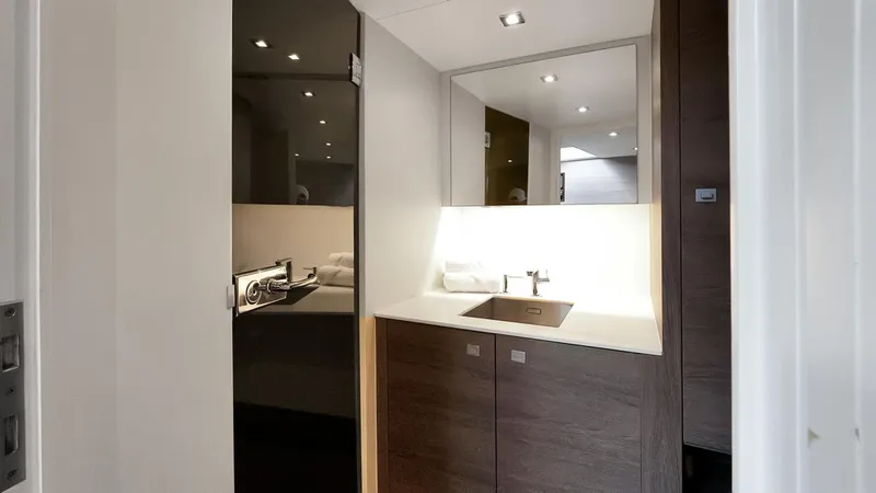 Slide: The Image of Interior of 2017 Vanquish Yachts VQ 54, featuring modern kitchenette design. - 23