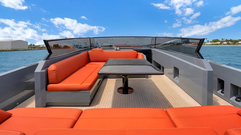 Slide: The Image of Luxurious 2017 Vanquish Yachts VQ 54 with orange seating and sleek design on open water. - 14