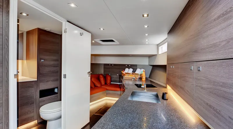Slide: The Image of Luxurious interior of 2017 Vanquish Yachts VQ 54 with modern kitchen and seating area. - 22