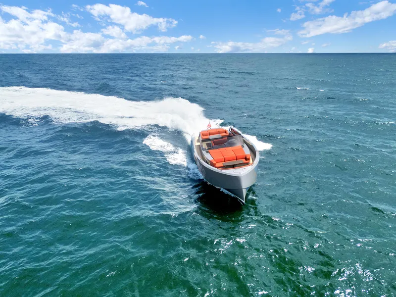 Slide: The Image of Vanquish Yachts VQ 54 (2017) cruising on open sea under clear blue sky. - 27