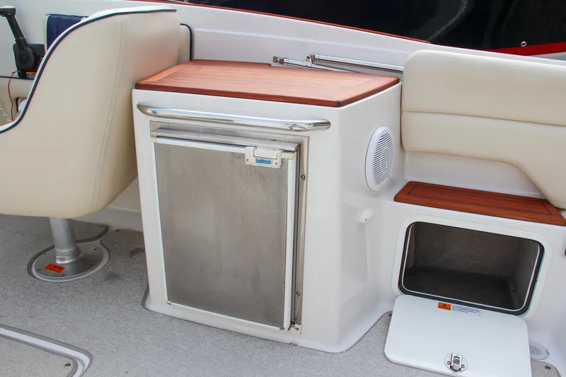 Slide: The Image of 2004 Chris-Craft Launch 25 boat interior with seating and storage area. - 12