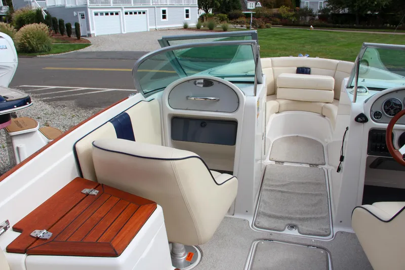 Slide: The Image of 2004 Chris-Craft Launch 25 boat interior with seating and dashboard. - 16