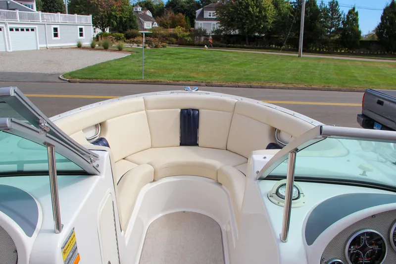 Slide: The Image of 2004 Chris-Craft Launch 25 boat interior with cream seating and dashboard view. - 27