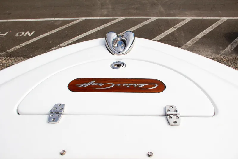 Slide: The Image of 2004 Chris-Craft Launch 25 boat bow with logo and chrome details. - 29