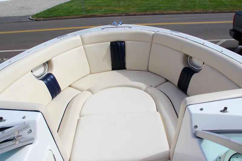 Slide: The Image of 2004 Chris-Craft Launch 25 boat interior with cream leather seating. - 33