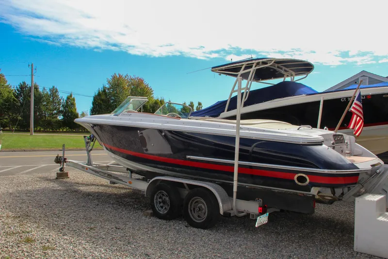 Slide: The Image of 2004 Chris-Craft Launch 25 boat on trailer, parked outdoors. - 36