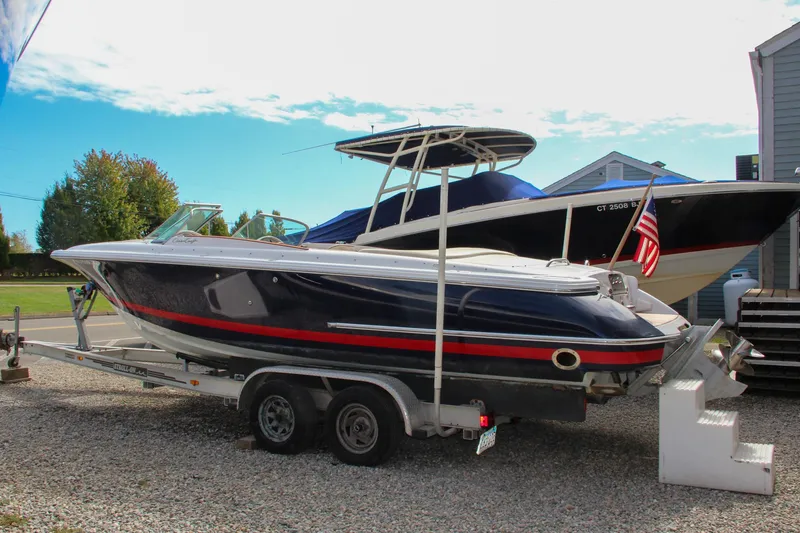 Slide: The Image of 2004 Chris-Craft Launch 25 boat on trailer, parked outdoors. - 37