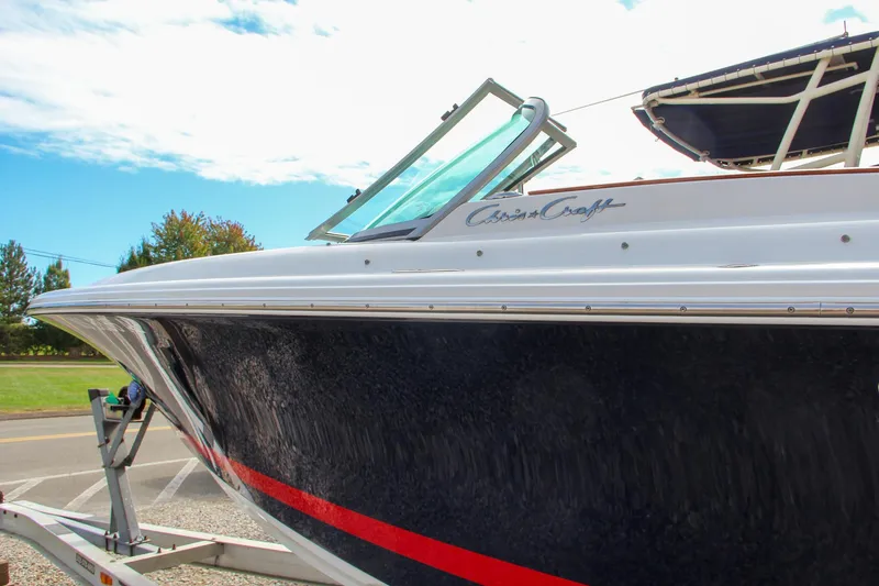 Slide: The Image of 2004 Chris-Craft Launch 25 boat with sleek design and vibrant colors. - 38