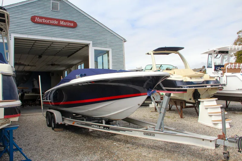 Slide: The Image of 2004 Chris-Craft Launch 25 boat on trailer at Harborside Marina. - 6