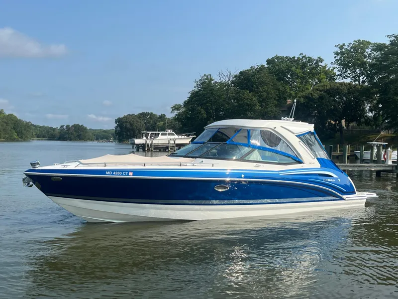 Slide: The Image of 2020 Formula 350 Crossover Bowrider on a calm river, surrounded by trees. - 3