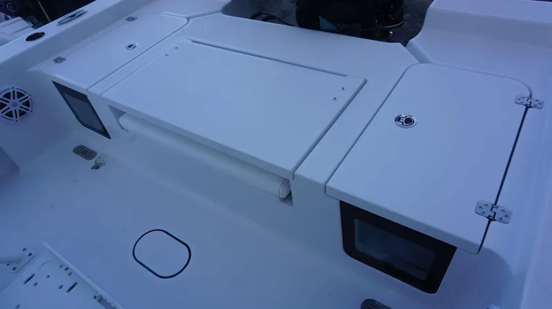 Slide: The Image of 2025 Sportsman 227 MASTERS boat deck with storage compartments and speaker. - 12