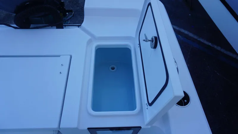 Slide: The Image of Open storage compartment on 2025 Sportsman 227 MASTERS boat. - 13