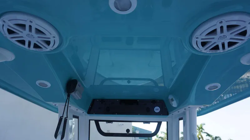 Slide: The Image of Interior view of 2025 Sportsman 227 MASTERS boat with speakers and controls. - 18