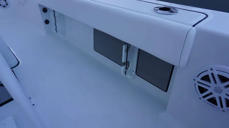 Slide: The Image of 2025 Sportsman 227 MASTERS boat interior with storage compartments and speaker. - 21