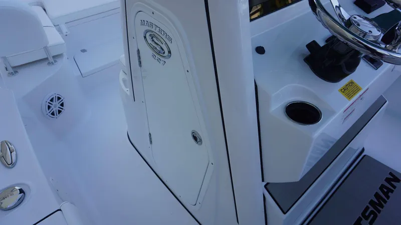 Slide: The Image of 2025 Sportsman 227 MASTERS boat interior with steering wheel and console details. - 22