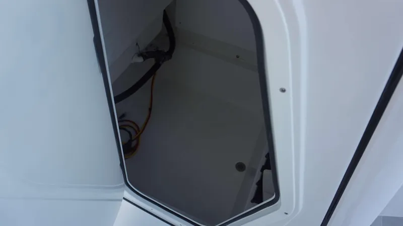 Slide: The Image of Open storage compartment in 2025 Sportsman 227 MASTERS boat. - 23