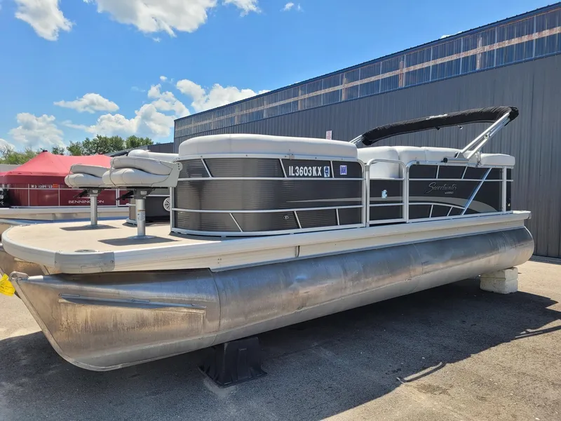 Slide: The Image of 2018 Sweetwater SW2286BF pontoon boat displayed outdoors under a clear sky. - 1