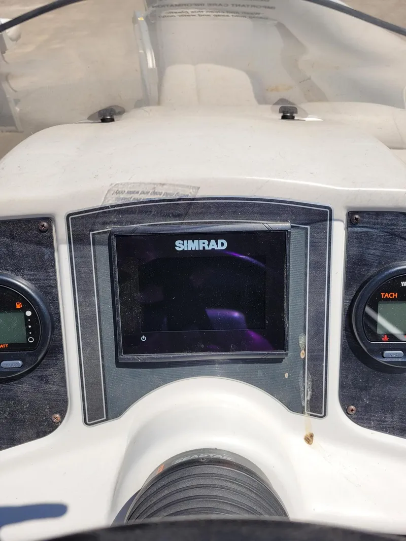 Slide: The Image of Dashboard of 2018 Sweetwater SW2286BF boat with Simrad display and tachometer. - 16