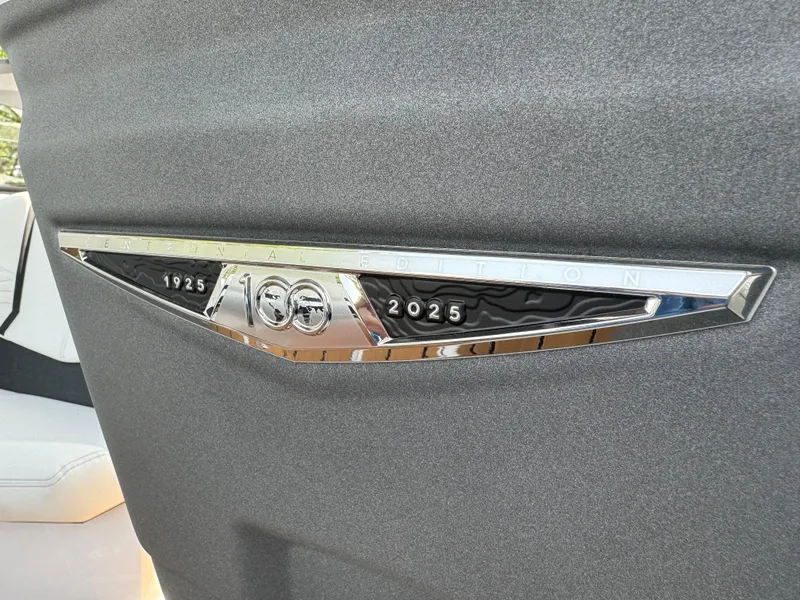 Slide: The Image of Nautique G23 2025, 100th Anniversary Edition emblem on sleek black surface. - 18