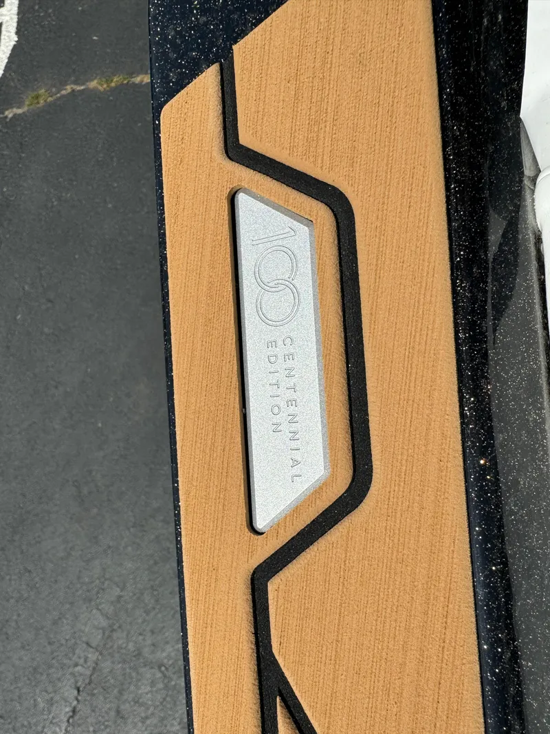 Slide: The Image of 2025 Nautique G23 Centennial Edition badge on boat deck. - 21