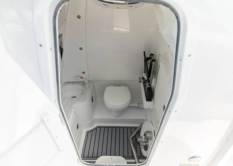 Slide: The Image of 2025 Sea Hunt Ultra 305 SE boat interior bathroom with modern amenities. - 10