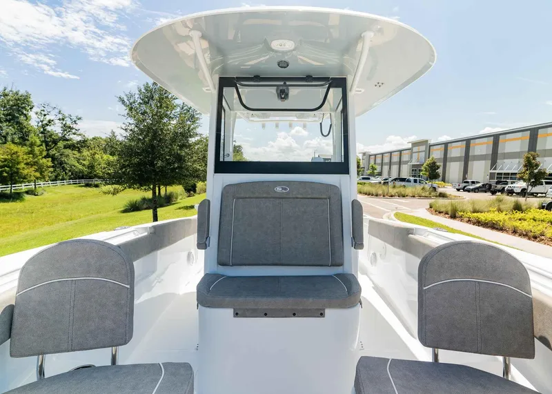 Slide: The Image of 2025 Sea Hunt Ultra 305 SE boat interior with seating and console. - 12