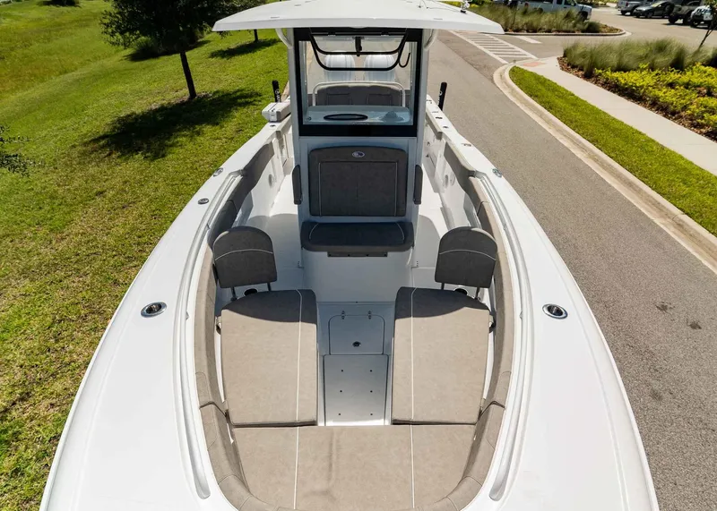 Slide: The Image of 2025 Sea Hunt Ultra 305 SE boat interior with spacious seating and modern design. - 13