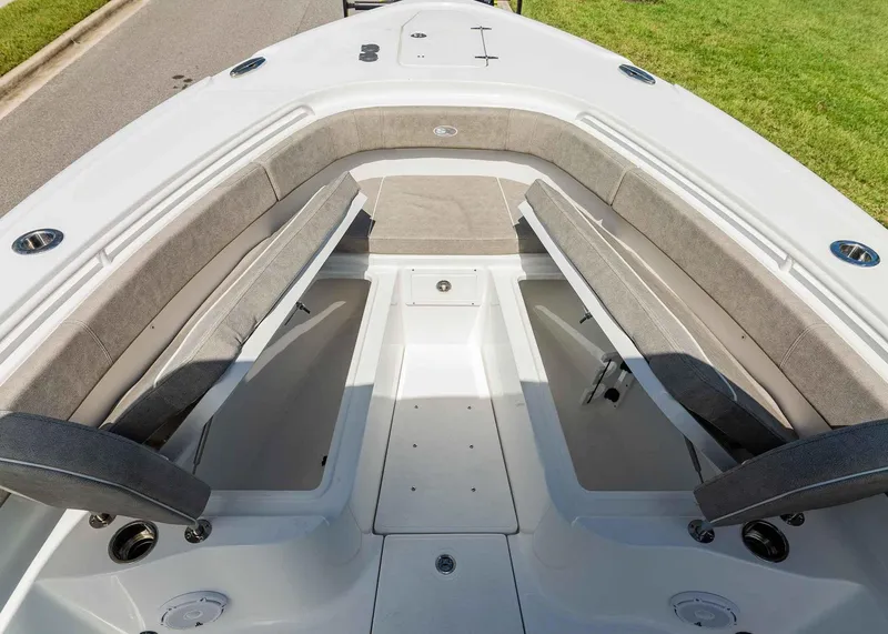 Slide: The Image of 2025 Sea Hunt Ultra 305 SE boat interior with spacious seating and storage compartments. - 14