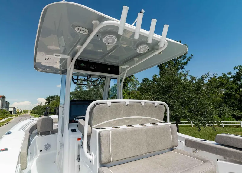 Slide: The Image of 2025 Sea Hunt Ultra 305 SE boat interior with seating and rod holders. - 21