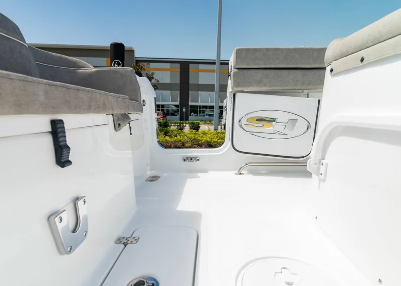 Slide: The Image of 2025 Sea Hunt Ultra 305 SE boat interior with seating and logo detail. - 23