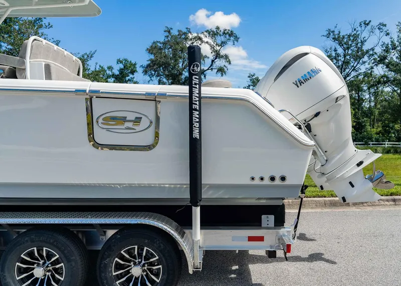 Slide: The Image of 2025 Sea Hunt Ultra 305 SE boat with Yamaha engine on trailer. - 3