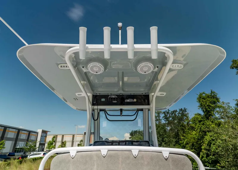 Slide: The Image of 2025 Sea Hunt Ultra 305 SE boat, featuring a sleek T-top design under a clear blue sky. - 7