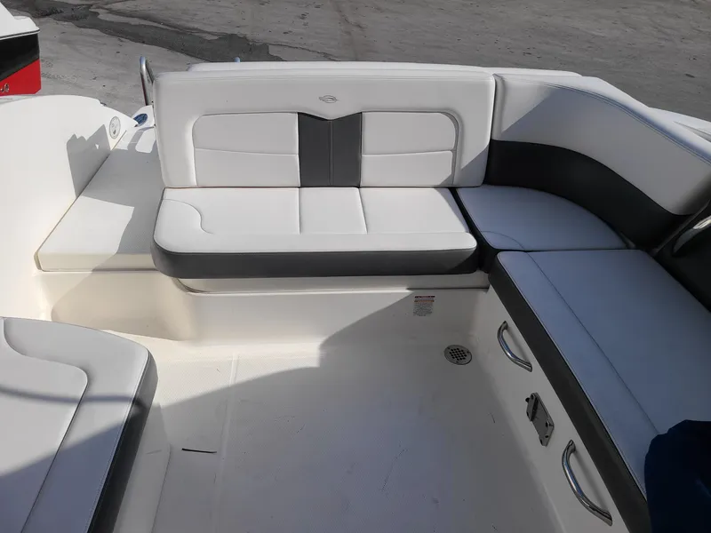 Slide: The Image of 2016 Chaparral 307 SSX boat interior with white and gray seating. - 14