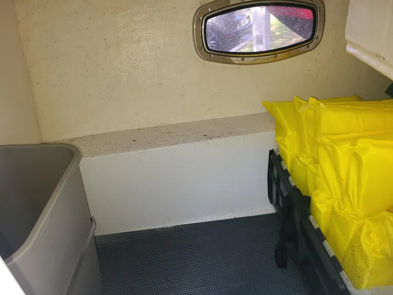 Slide: The Image of Interior cabin of 2016 Chaparral 307 SSX boat with storage and window. - 19