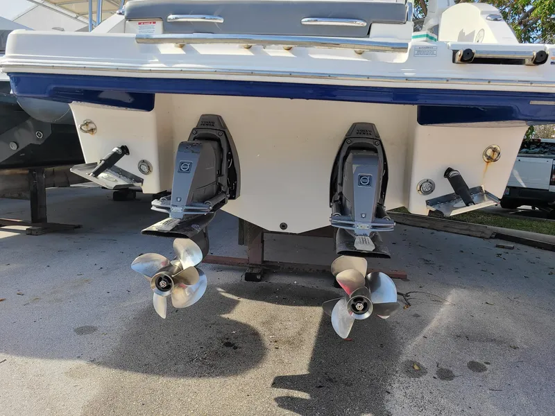 Slide: The Image of 2016 Chaparral 307 SSX boat with dual propellers and outboard motors. - 4