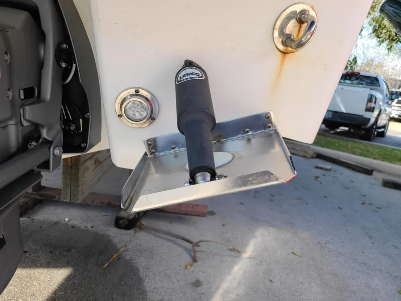 Slide: The Image of Close-up of 2016 Chaparral 307 SSX boat trim tab and hardware. - 6