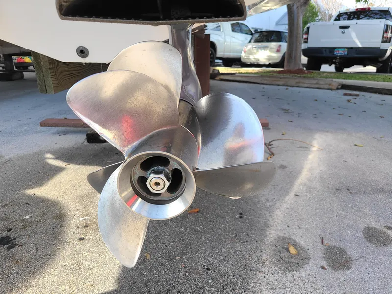 Slide: The Image of Close-up of a 2016 Chaparral 307 SSX boat propeller on pavement. - 7
