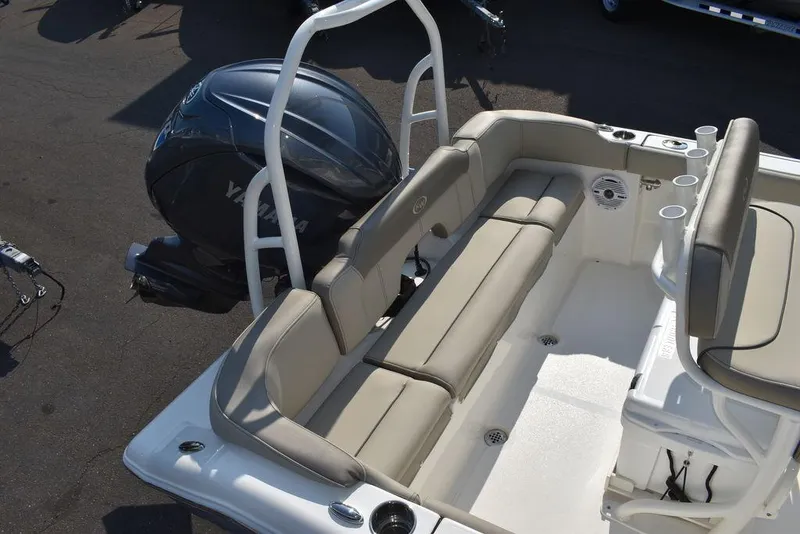 Slide: The Image of 2024 Key West 203 FS boat with Yamaha engine, featuring beige seating and cup holders. - 11