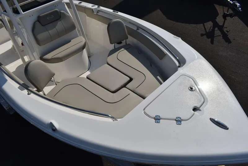 Slide: The Image of 2024 Key West 203 FS boat interior with cushioned seating and storage compartments. - 16