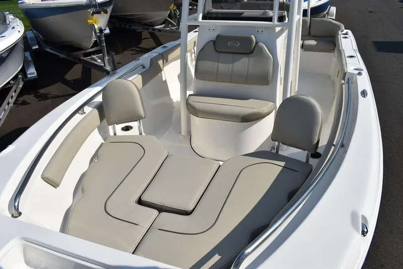 Slide: The Image of 2024 Key West 203 FS boat interior with cushioned seating and sleek design. - 19