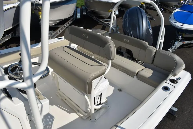 Slide: The Image of 2024 Key West 203 FS boat interior with seating and steering wheel. - 21