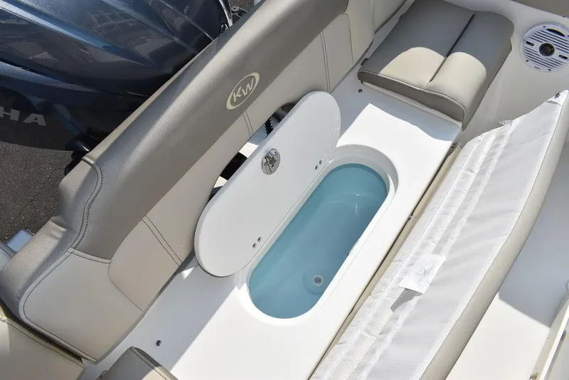 Slide: The Image of 2024 Key West 203 FS boat interior with seating and storage compartment. - 27