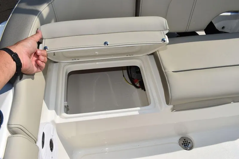 Slide: The Image of 2024 Key West 203 FS boat seat storage compartment open. - 28