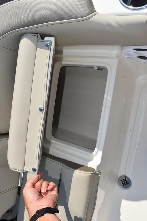 Slide: The Image of 2024 Key West 203 FS boat storage compartment with cushioned seat. - 29