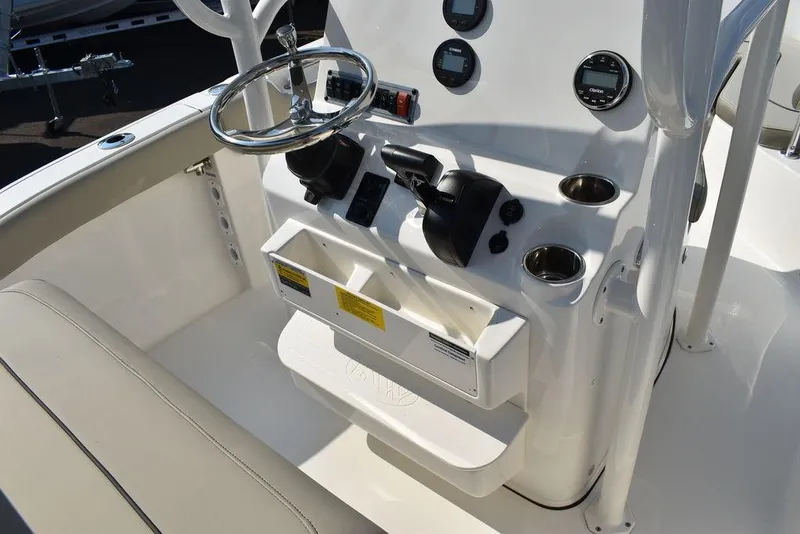 Slide: The Image of 2024 Key West 203 FS boat console with steering wheel and controls. - 33