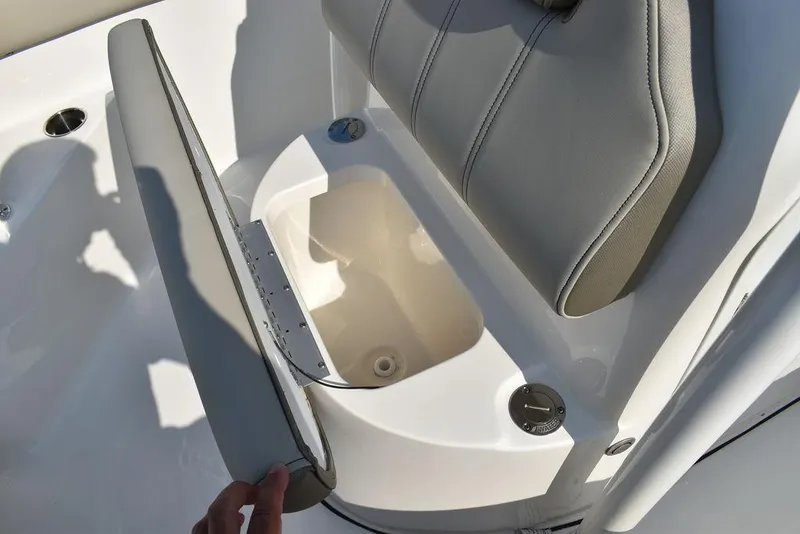 Slide: The Image of 2024 Key West 203 FS boat seat with storage compartment open. - 41