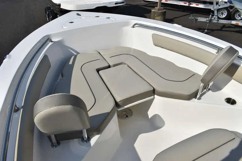 Slide: The Image of 2024 Key West 203 FS boat interior with cushioned seating and sleek design. - 42