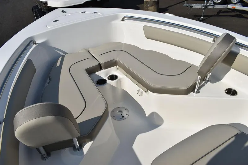 Slide: The Image of 2024 Key West 203 FS boat interior with beige seating and cup holders. - 45